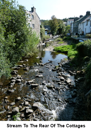 Stream to the rear of the properties.