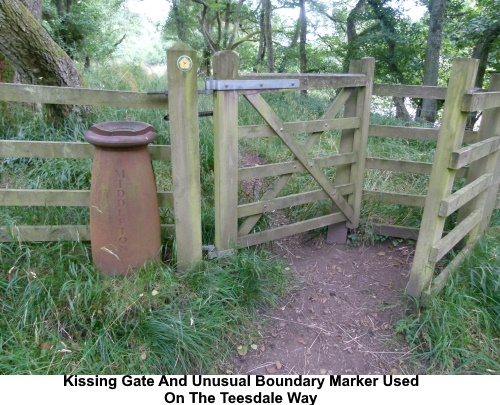 A kissing gate and unusual boundary marker on the Teesdale Way.