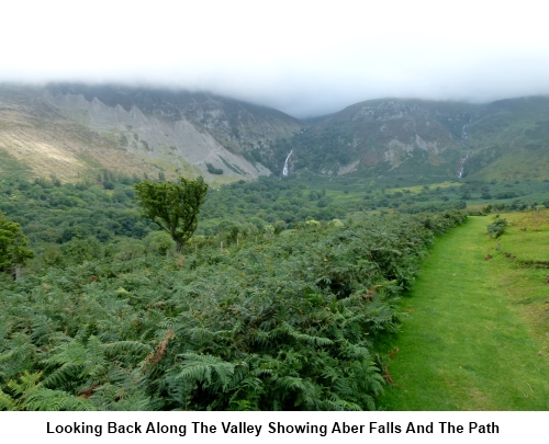 A view back along the valley showing Aber Falls and the footpath.