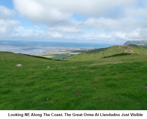 A view north east along the coast to the Great Orme at Llandudno.