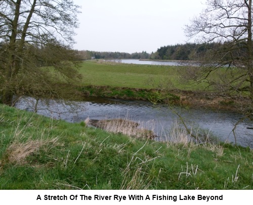 The River Rye with a fishing lake behind.