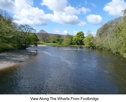 View along the river Wharfe from the footbridge.