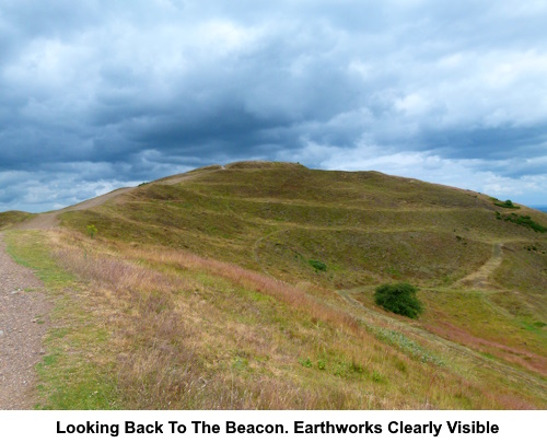 Looking back to Herefordshire Beacon. The earthworks are clearly visible.