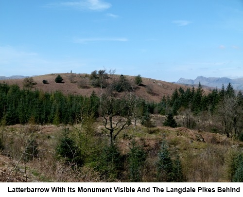 Latterbarrow showing its monument, with the Langdale Pikes behind.