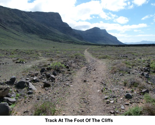 Track at the foot of the cliffs.