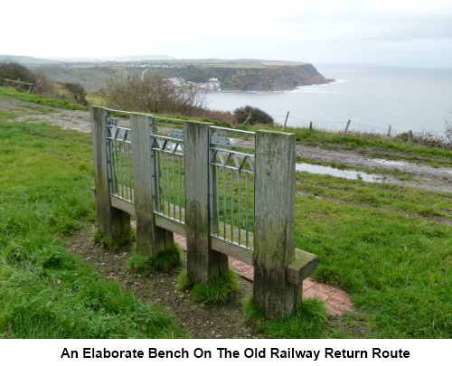 An elaborate bench on the old railway track