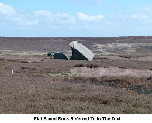 A large flat faced rock acting as a landmark referred to in the text.