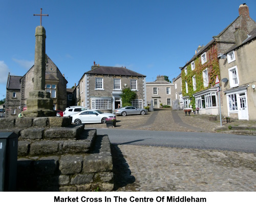 The market cross in the cenrte of Mioddleham.