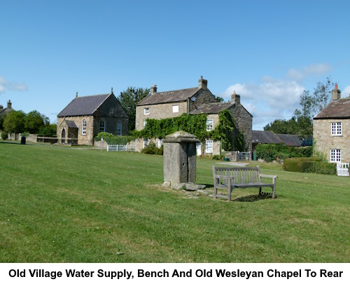 The old village water supply. To the rear is the old Wesleyan chapel.