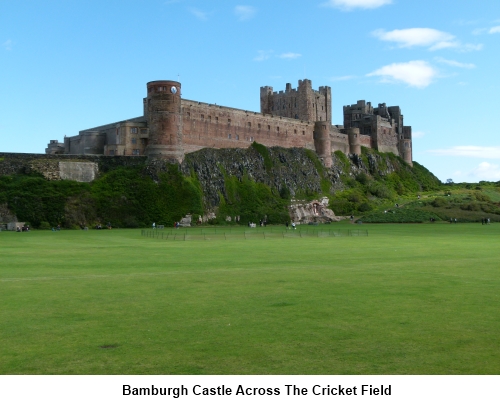 A view of Bamburgh Castle across the cricket field.