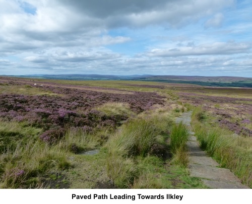 Paved path leading towards Ilkley