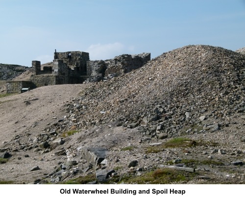 Old waterwheel building and spoil heap