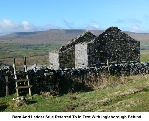 Barn and ladder stile with view to Whernside